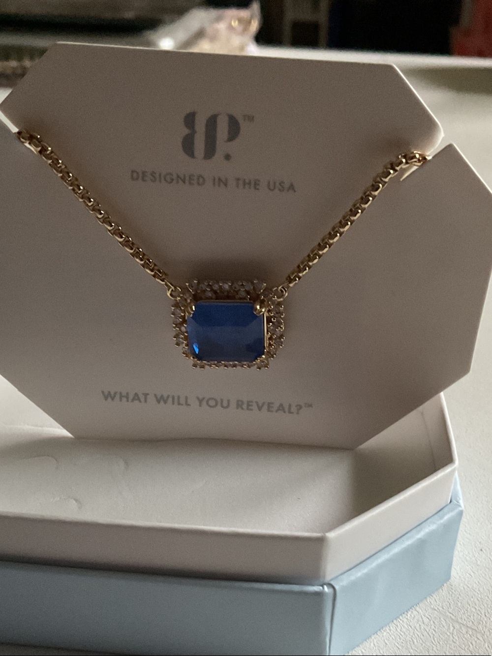 bp Gold-Tone Necklace with Blue Rectangular Gem and Halo